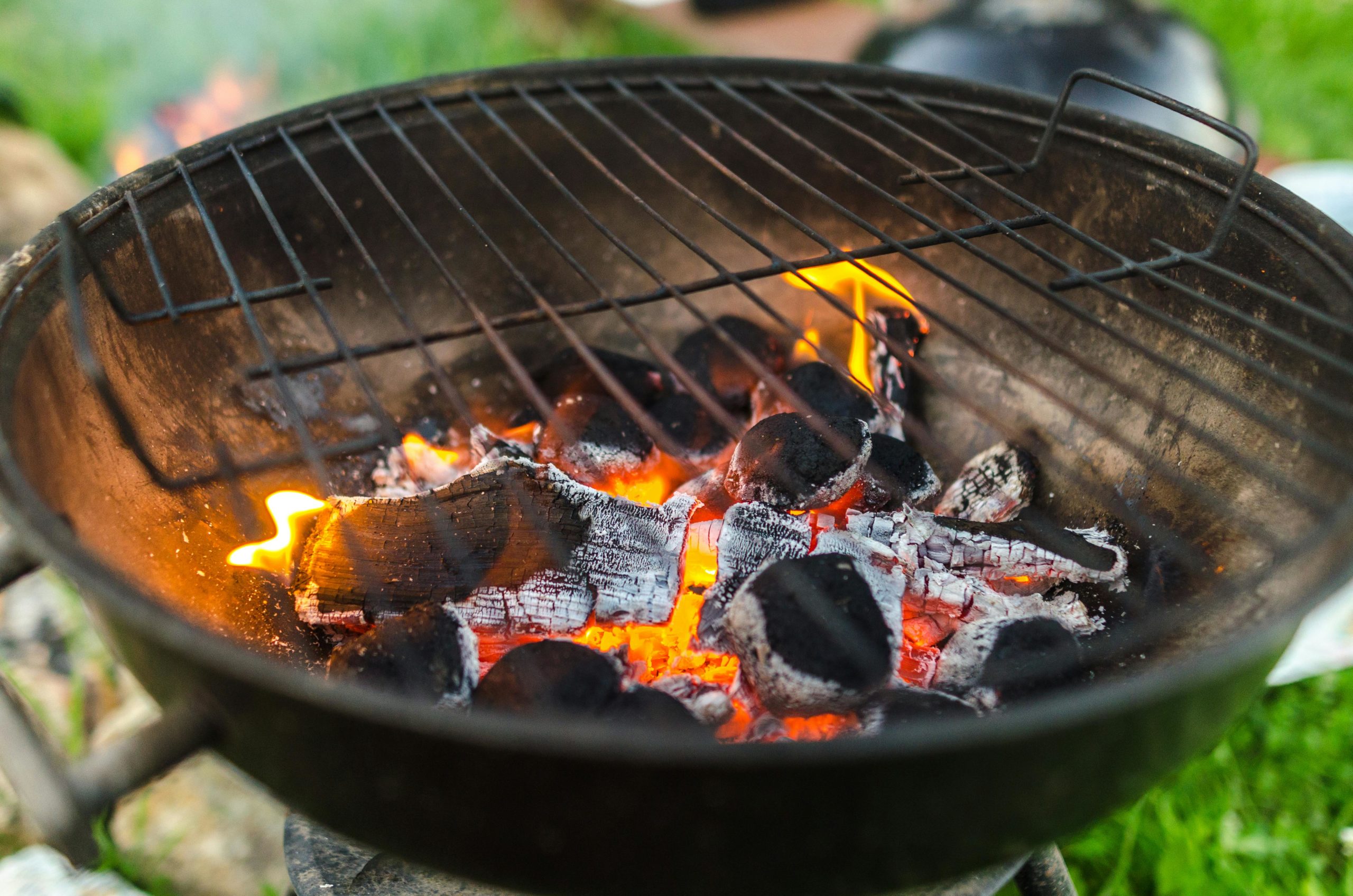 Charcoal grill with hot coals.